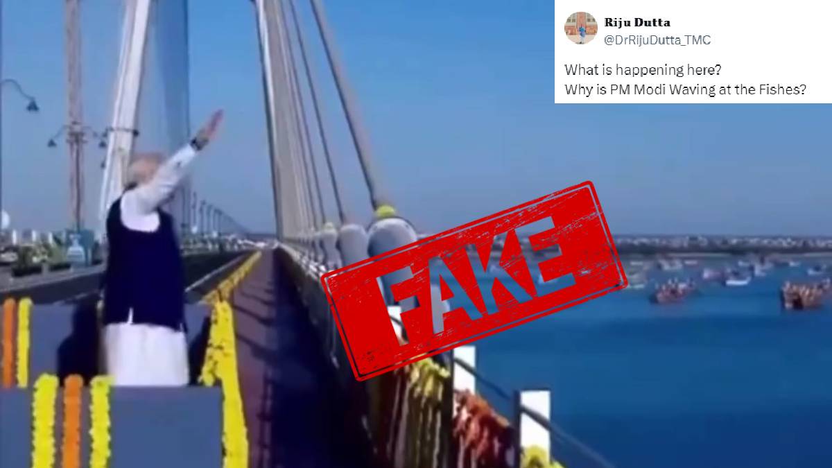 Screenshot from viral video shared with claims that PM Narendra Modi was waving at the fishes